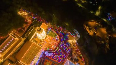 Bayan Lepas, Penang, Malaysia - Jan 28 2022: Drone shot hyperlapse descending and reveal KeK Lok Si temple in night