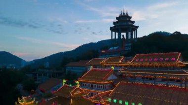 Georgetown, Penang, Malaysia - Feb 19 2022: Aerial hyperlapse of opening lighting at Kek Lok Si temple in dusk hour