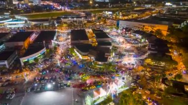 Sungai Nibong, Penang, Malaysia - Oct 08 2022: Aerial view hyperlapse circular Auto City Carnival car gathering in night