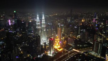 Bukit Bintang, Kuala Lumpur, Malaysia - Nov 09 2022: Aerial view night scape of illuminated KLCC twin tower skyscraper in night