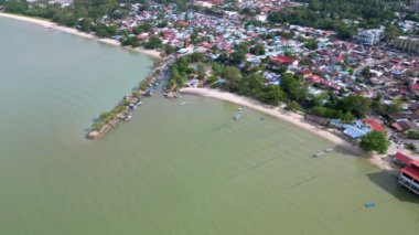 Aerial fly toward the bay at Teluk Bahang fishing village