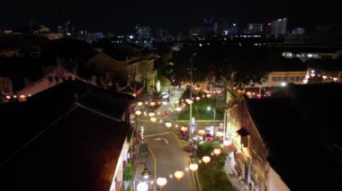 Aerial fly over old heritage building decorated with red lantern in night