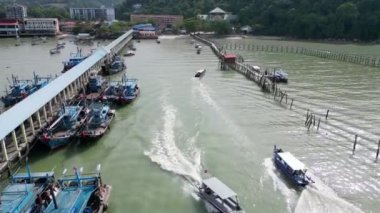 Teluk Bahang, Penang, Malaysia - Jan 02 2023: Busy fishing village with boat move in and our