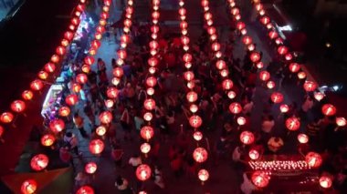 Georgetown, Penang, Malaysia - Jan 21 2023: Aerial view people take photo with Chinese prosperity in mascot at Goddess of Mercy temple