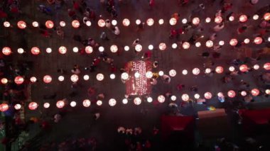 Georgetown, Penang, Malaysia - Jan 21 2023: Aerial top down view Chinese devotees pray at Chinese temple decorated with red lantern
