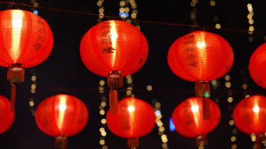 George Town, Penang, Malaysia - Feb 09 2024: A row of red lanterns hanging from the ceiling. The lanterns are lit up at Goddess of Mercy Temple