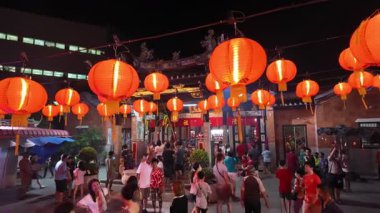 Bayan Lepas, Penang, Malaysia - Feb 14 2024: Devotees offering prayers at the sacred Snake Temple in Penang.