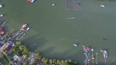 Kong Kong, Johor, Malaysia - Apr 29 2024: Sungai Johor river of boats and houses on the shore