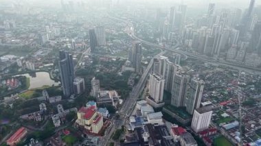 Bukit Bintang, Kuala Lumpur, Malaysia - Dec 07 2024: City stretches out with shimmering windows and bustling streets from the sky.