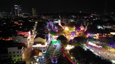Bandar Hilir, Melaka, Malaysia - Mar 01 2024: Drone captures a small boat navigating in Melaka at night