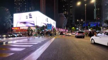 Bukit Bintang, Kuala Lumpur, Malaysia - Jun 17 2024: People are on a street corner.
