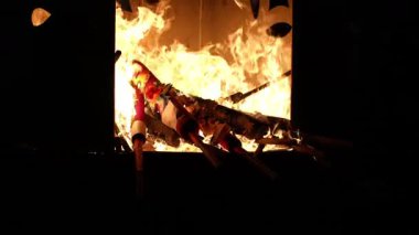 George Town, Penang, Malaysia - Feb 09 2024: Devotees place incense into the furnace with quiet reverence at Goddess of Mercy Temple.