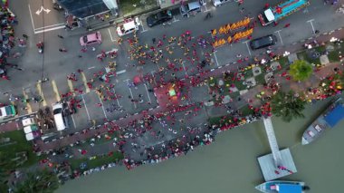 Kota Tinggi, Johor, Malaysia - Apr 28 2024: A colorful procession celebrates Mazu with dancers, lanterns, and divine statues.