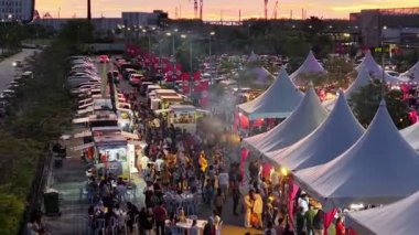Batu Kawan, Penang, Malaysia - Nov 10 2024: Colorful canopies and lights form a food street from above at Design Village