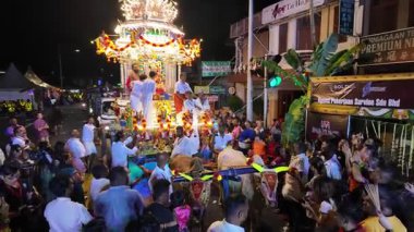 George Town, Penang, Malaysia - Jan 26 2024: The silver chariot carrying Lord Murugan travels through the streets at night.