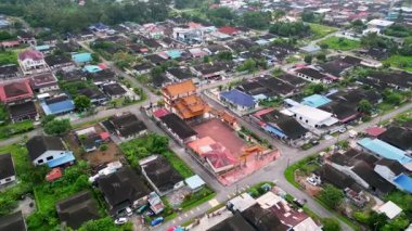 Pekan Nanas, Johor, Malaysia - Jun 04 2024: Aerial view Pekan house estate and temple