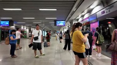 Punggol, Singapore - Jul 17 2024: A group of people are waiting in line at MRT East Coast Line