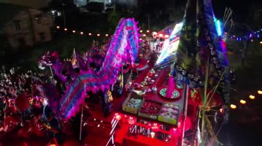 Bukit Mertajam, Penang, Malaysia - Feb 17 2024: The vibrant dragon moves under lantern light during the divine celebration when during Jade Emperor Birthday celebration