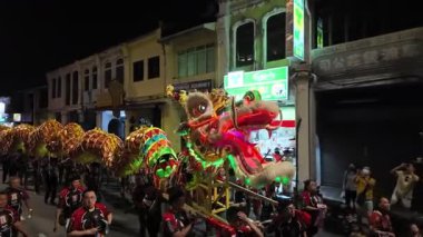 George Town, Penang, Malaysia - Feb 24 2024: Traditional dragon dance mesmerizes onlookers during street festivities during Poh Hock Seah Grand Float Procession