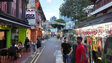 China Town, Singapore - Jul 10 2024: A busy street with a green building at Chinatown