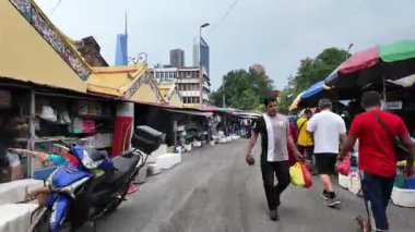 Bukit Bintang, Kuala Lumpur, Malaysia - Jun 16 2024: Close-up of colorful neatly stacked at a Pasar Pudu stall.