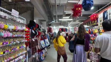 China Town, Singapore - Jul 10 2024: A group of people are shopping in a store at Chinatown Complex