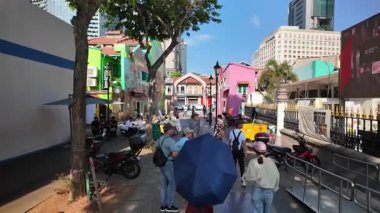 Kampung Glam, Singapore - Jul 11 2024: People walk down street in sunny day