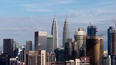 Bukit Bintang, Kuala Lumpur, Malaysia - Dec 08 2024: Aerial view of the city skyline under clear blue skies.