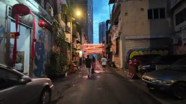 Bukit Bintang, Kuala Lumpur, Malaysia - Jun 17 2024: People walking down the street with lantern background