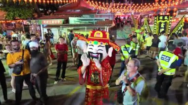 Bayan Lepas, Penang, Malaysia - Feb 14 2024: Chinese prosperity god welcome the crowd at snake temple