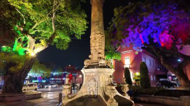 Bandar Hilir, Melaka, Malaysia - Mar 04 2024: Queen Victoria's Fountain with a statue of a man on top. The statue is surrounded by a lot of trees