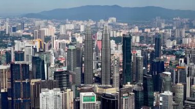 Bukit Bintang, Kuala Lumpur, Malaysia - Dec 08 2024: Wide-angle aerial shot showcasing tall skyscrapers KLCC in bright daylight.
