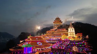 Ayer Itam, Penang, Malaysia - Feb 04 2024: Fireworks sparkle over Kek Lok Si Temple iconic structure.