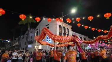 George Town, Penang, Malaysia - Feb 09 2024: Dragon dance performance lights up the night during Chinese New Year