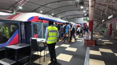 Bukit Bintang, Kuala Lumpur, Malaysia - Jun 15 2024: A LRT train station busy people in and out