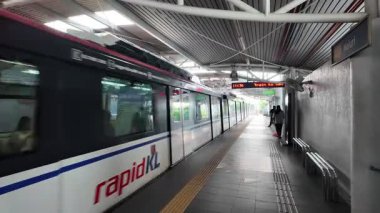 Bukit Bintang, Kuala Lumpur, Malaysia - Jun 18 2024: A Rapid KL monorail train is on the tracks at a train station