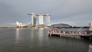 Marina Bay, Singapore - Jul 09 2024: People are walking on the pier at Merlion Park