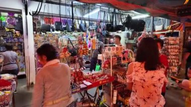 Bayan Lepas, Penang, Malaysia - Feb 14 2024: A group of people are shopping in a store at snake temple