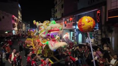 George Town, Penang, Malaysia - Feb 24 2024: A dragon is being carried by a group of people during Poh Hock Seah Grand Float Procession