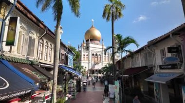 Kampung Glam, Singapore - Jul 11 2024: A street with Sultan Mosque with a dome on top