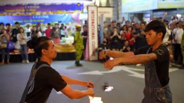 George Town, Penang, Malaysia - Nov 03 2024: Fire flame show lights up the street at night.