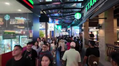 Bukit Bintang, Kuala Lumpur, Malaysia - Dec 07 2024: Busy shopping mall with a Starbucks on the right