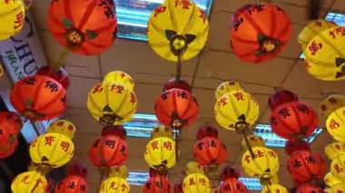 Ayer Itam, Penang, Malaysia - Feb 04 2024: Glowing lanterns bring color to the sacred temple at Kek Lok Si