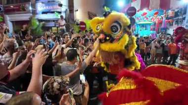 George Town, Penang, Malaysia - Feb 09 2024: Cultural lion dance ritual performed at a historic temple site.