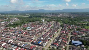 Kota Tinggi, Johor, Malaysia - Apr 29 2024: A with buildings and a blue sky. The buildings are mostly red