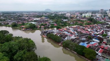 Alor Setar, Kedah, Malaysia - Jan 07 2024: A town with a river flow through it. The river is brown and the is full of buildings