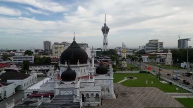Alor Setar, Kedah, Malaysia - Jan 08 2024: Approaching Zahir Mosque from above in a graceful aerial sweep.
