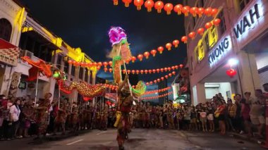 George Town, Penang, Malaysia - Jan 27 2024: A group of people perform dragon and phoenix dance during Kwong Wah Yit Poh Chinese New Year Gala