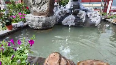 Ayer Itam, Penang, Malaysia - Feb 04 2024: Tilt up buddha statue at Kek Lok Si Temple
