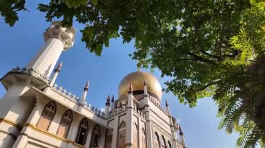 Kampung Glam, Singapore - Jul 11 2024: Sultan Mosque with a dome on top in blue sky